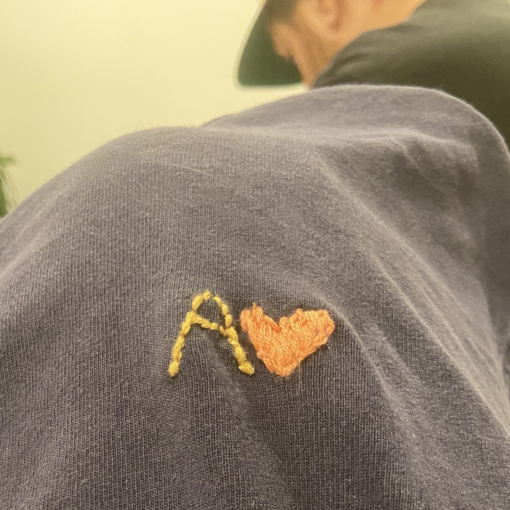 Embroidered letter A and heart