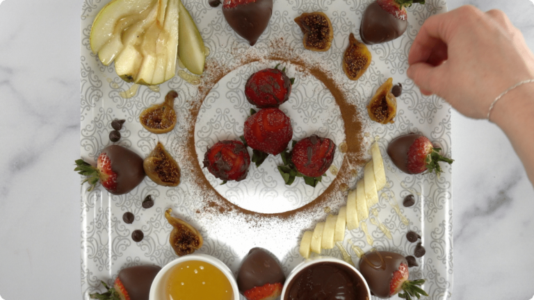 A plate with yummy aphrodisiac foods like chocolate strawberries