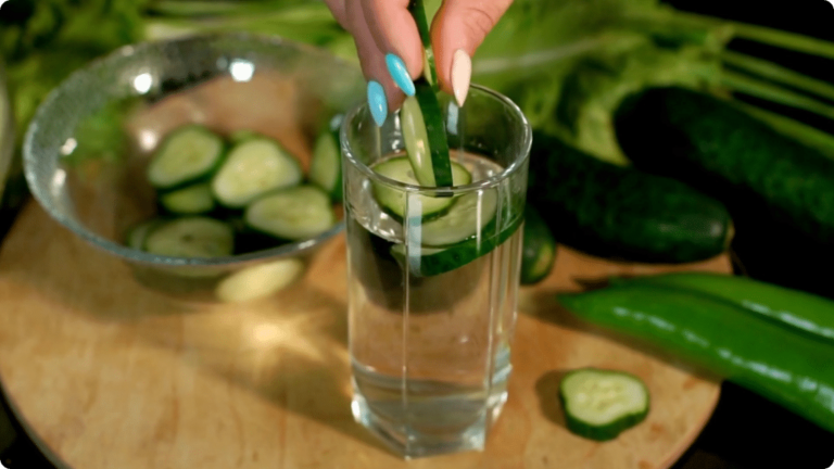 A relaxing glass of spa water with cucumbers for a virtual spa date