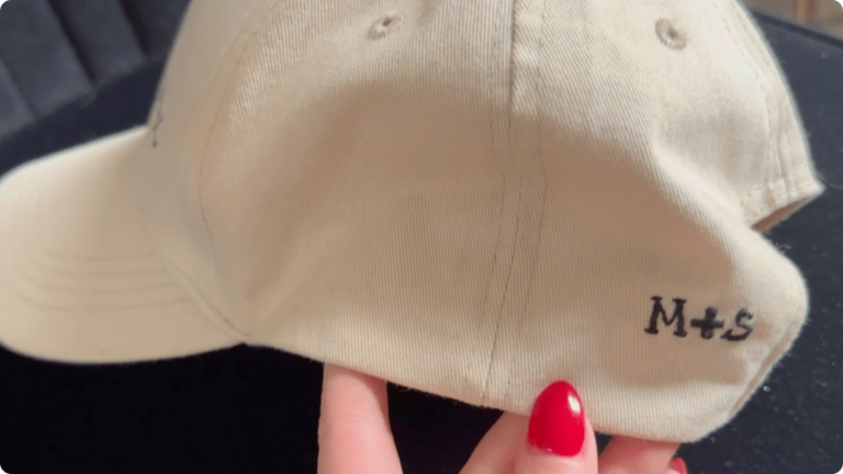 A hat embroidered with a couple's initials